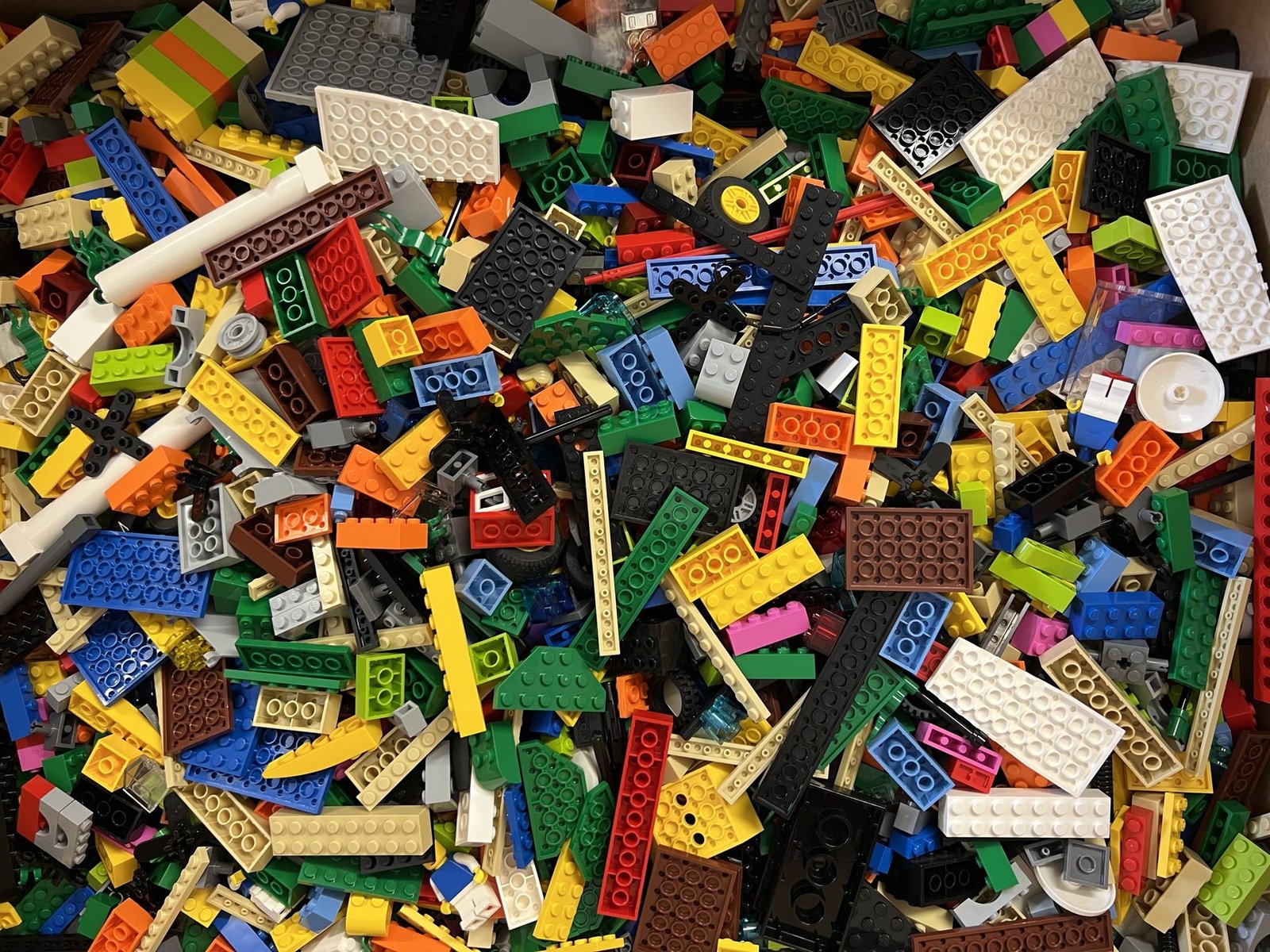 Workshop participants building a shared LEGO model